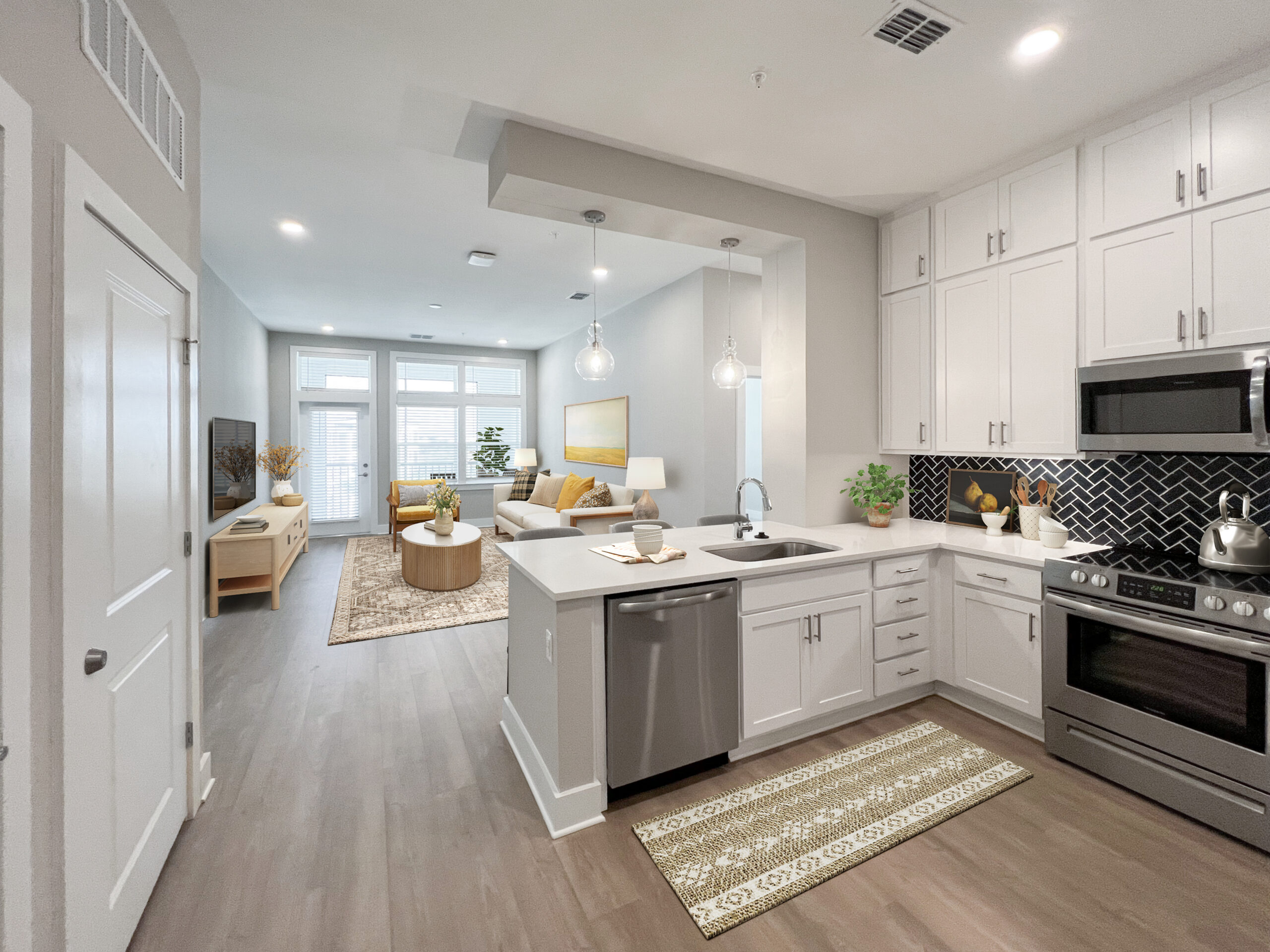 Bed and hanging pictures inside luxury one bedroom Kissimmee apartment