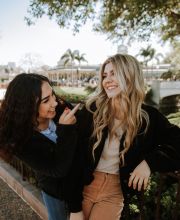 Two girls outside smiling