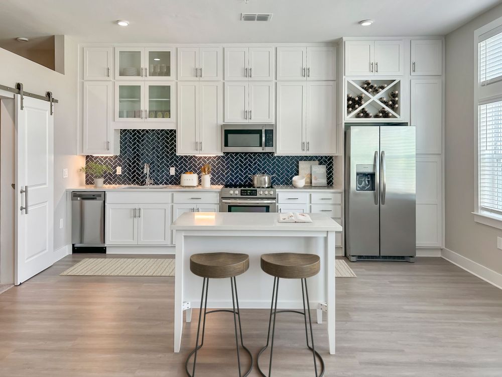 The Lucent at Sunrise apartments kitchen showing double upper kitchen cabinets and wine storage