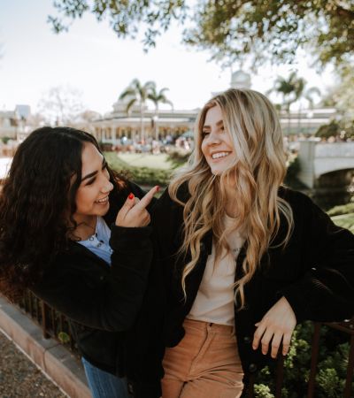 Two girls outside smiling